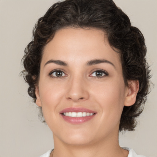 Joyful white young-adult female with medium  brown hair and brown eyes