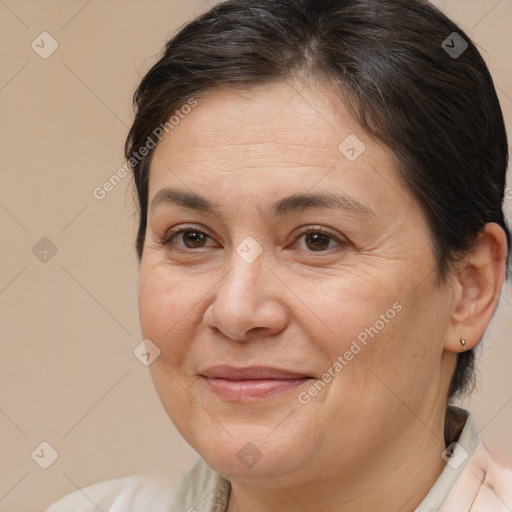 Joyful white adult female with medium  brown hair and brown eyes