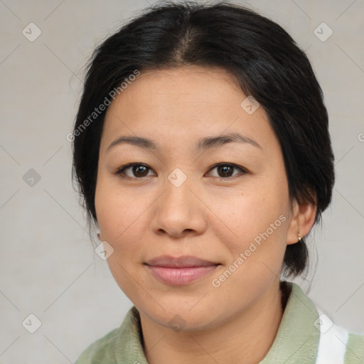 Joyful asian adult female with medium  brown hair and brown eyes