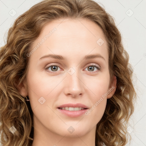 Joyful white young-adult female with long  brown hair and blue eyes