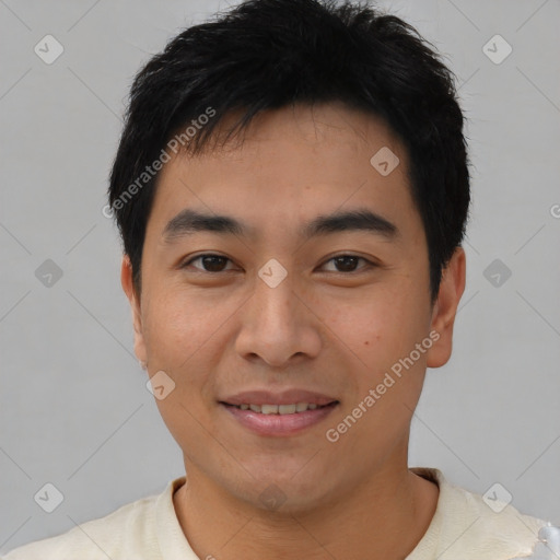 Joyful asian young-adult male with short  brown hair and brown eyes