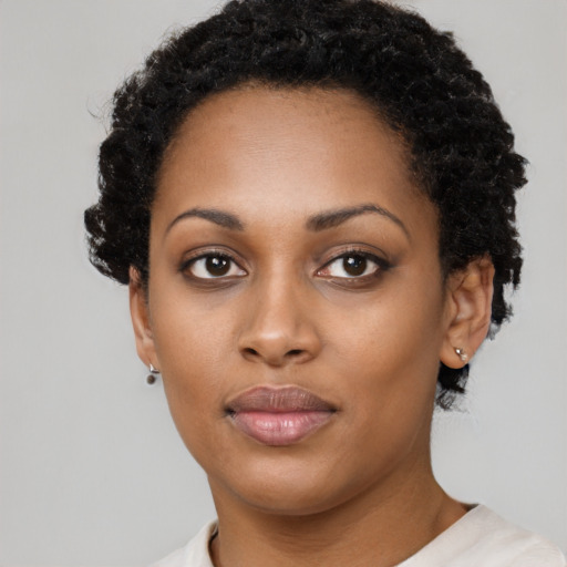 Neutral black young-adult female with short  black hair and brown eyes