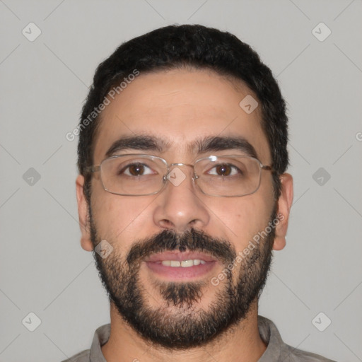 Joyful latino young-adult male with short  black hair and brown eyes