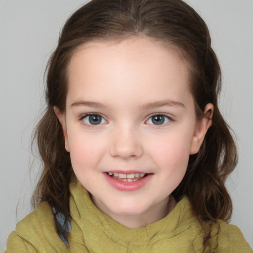 Joyful white child female with medium  brown hair and brown eyes