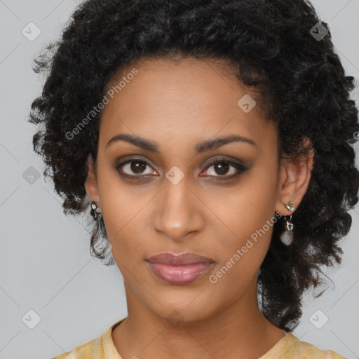 Joyful black young-adult female with long  brown hair and brown eyes