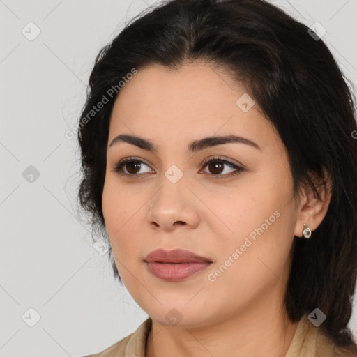 Joyful latino young-adult female with medium  brown hair and brown eyes