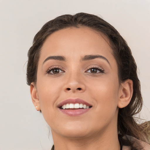 Joyful white young-adult female with long  brown hair and brown eyes