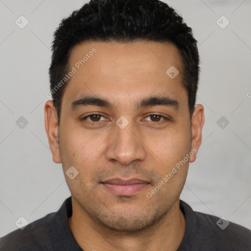 Joyful white young-adult male with short  black hair and brown eyes