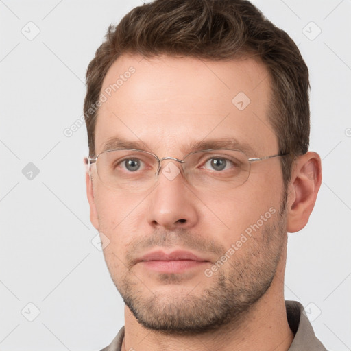 Neutral white young-adult male with short  brown hair and grey eyes