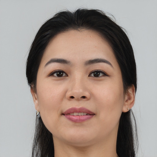 Joyful asian young-adult female with medium  black hair and brown eyes