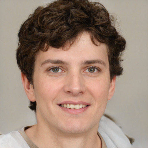 Joyful white young-adult male with medium  brown hair and brown eyes