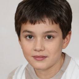 Joyful white child male with short  brown hair and brown eyes