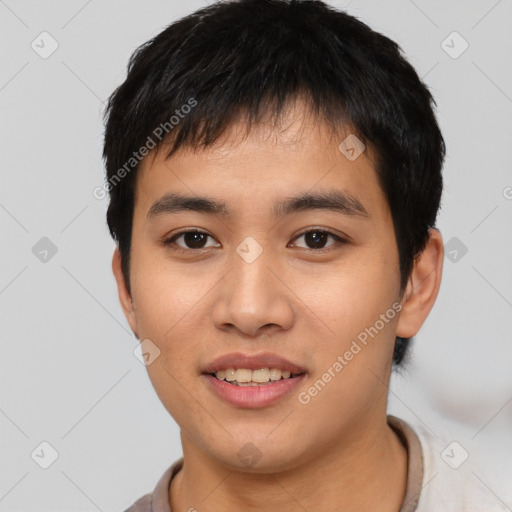 Joyful asian young-adult male with short  brown hair and brown eyes