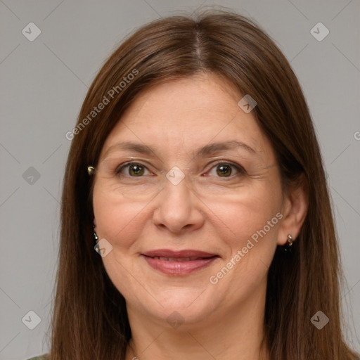 Joyful white adult female with long  brown hair and brown eyes