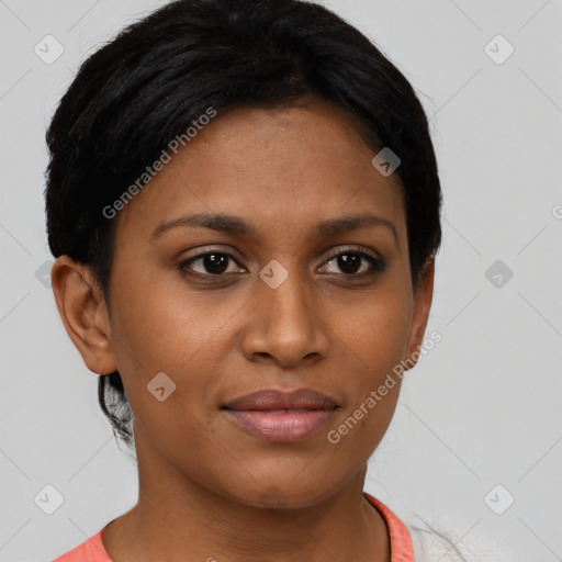 Joyful black young-adult female with short  brown hair and brown eyes