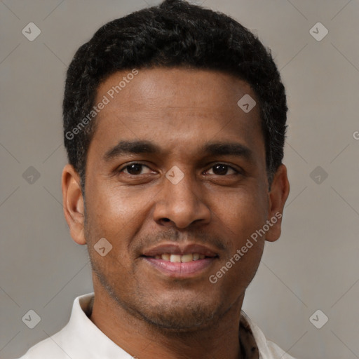 Joyful latino young-adult male with short  black hair and brown eyes