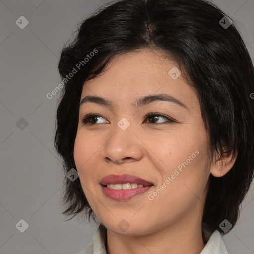 Joyful asian young-adult female with medium  black hair and brown eyes