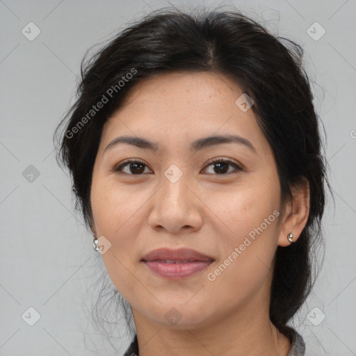 Joyful asian adult female with medium  brown hair and brown eyes