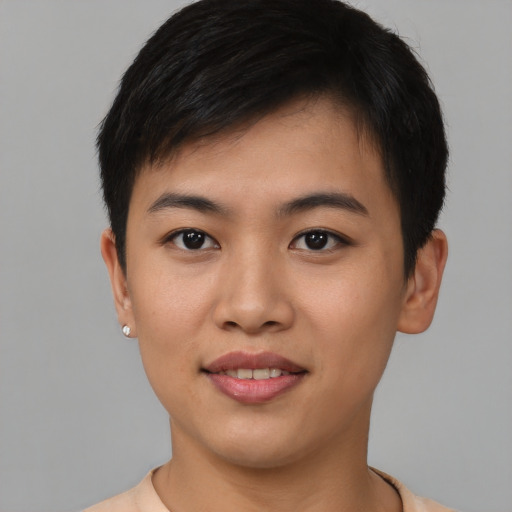 Joyful asian young-adult male with short  brown hair and brown eyes