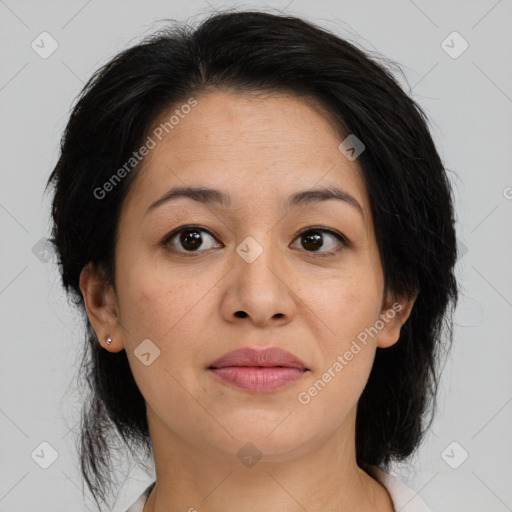 Joyful asian adult female with medium  brown hair and brown eyes