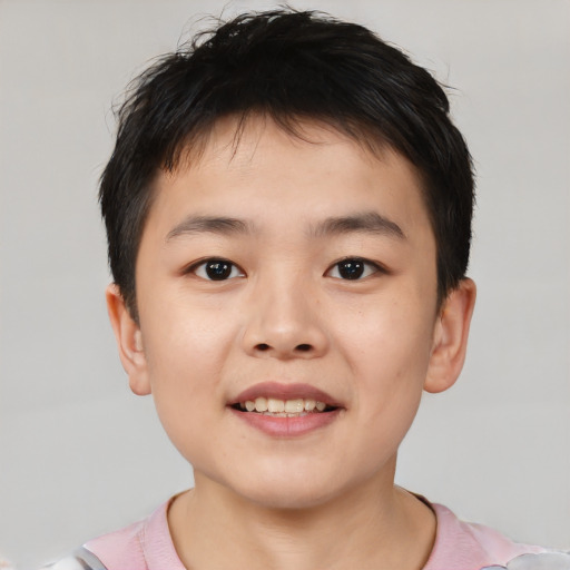 Joyful white child male with short  brown hair and brown eyes
