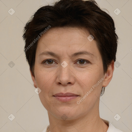 Joyful white adult female with short  brown hair and brown eyes