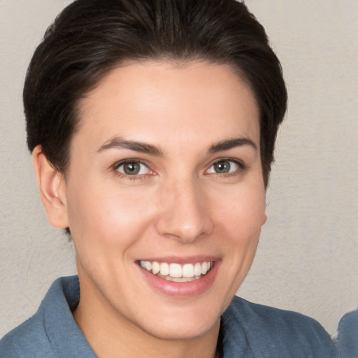 Joyful white young-adult female with medium  brown hair and brown eyes