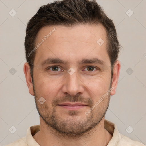 Joyful white adult male with short  brown hair and brown eyes