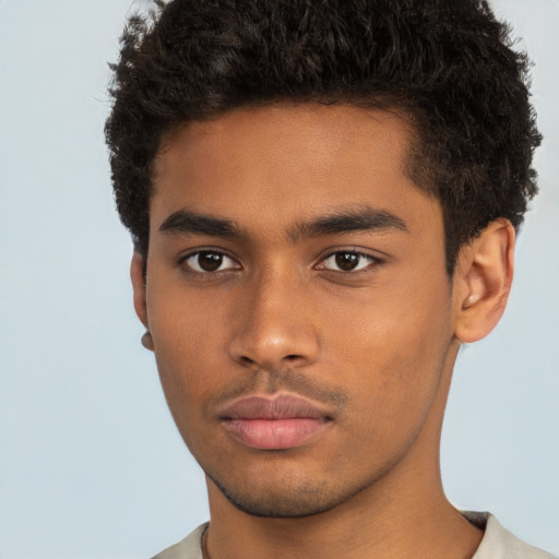 Neutral black young-adult male with short  brown hair and brown eyes