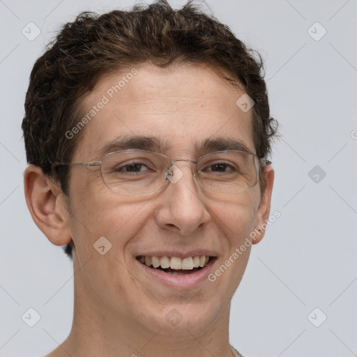 Joyful white adult male with short  brown hair and brown eyes