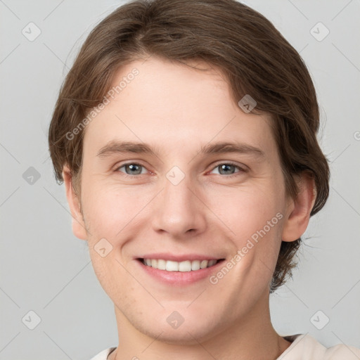 Joyful white young-adult female with short  brown hair and grey eyes