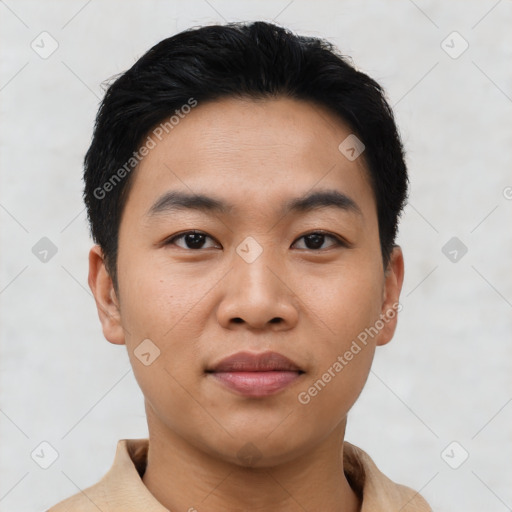 Joyful asian young-adult male with short  black hair and brown eyes