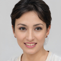 Joyful asian young-adult female with medium  brown hair and brown eyes