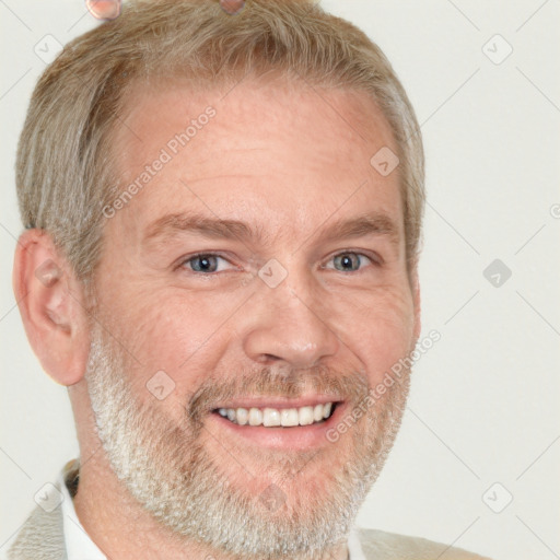 Joyful white adult male with short  brown hair and grey eyes