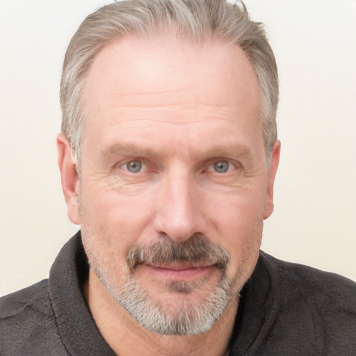 Joyful white adult male with short  gray hair and grey eyes