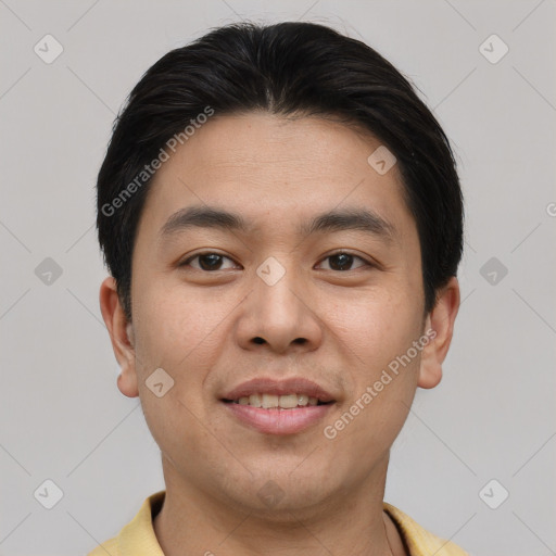 Joyful asian young-adult male with short  brown hair and brown eyes