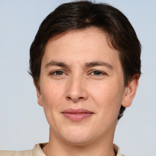 Joyful white adult female with short  brown hair and brown eyes