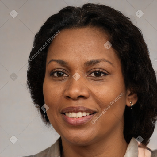 Joyful black adult female with medium  brown hair and brown eyes