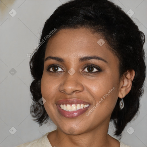 Joyful black young-adult female with medium  black hair and brown eyes