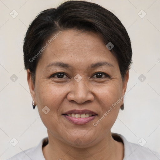 Joyful white adult female with short  brown hair and brown eyes