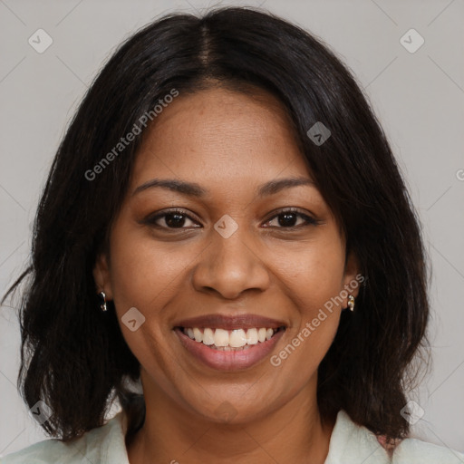 Joyful black young-adult female with medium  brown hair and brown eyes