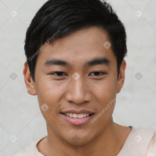 Joyful asian young-adult male with short  black hair and brown eyes