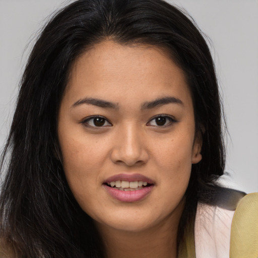 Joyful asian young-adult female with long  brown hair and brown eyes