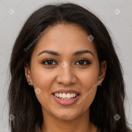 Joyful latino young-adult female with long  brown hair and brown eyes