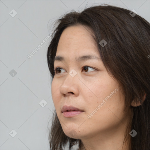 Neutral white young-adult female with long  brown hair and brown eyes