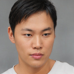 Neutral asian young-adult male with short  brown hair and brown eyes