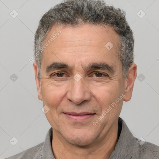 Joyful white middle-aged male with short  brown hair and brown eyes