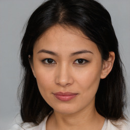 Joyful asian young-adult female with medium  brown hair and brown eyes