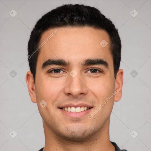 Joyful white young-adult male with short  black hair and brown eyes