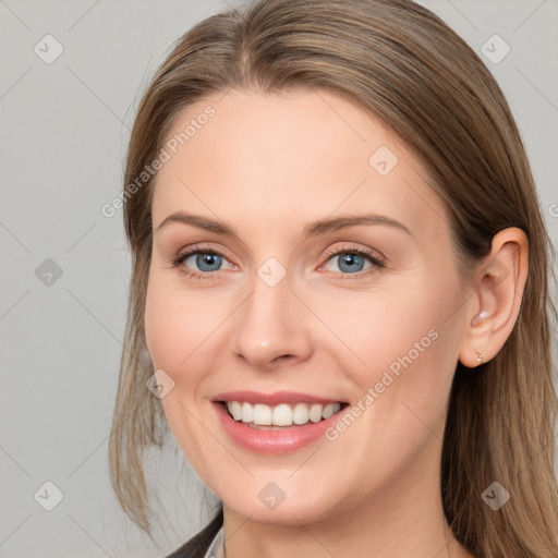 Joyful white young-adult female with medium  brown hair and blue eyes